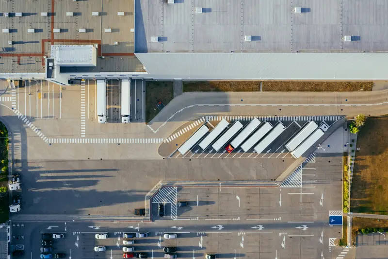 Aerial view of trailers backed into the loading docks of a distribution center